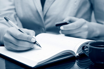 Businesswoman writing
