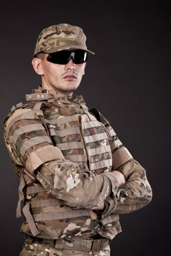 Military man on a black background