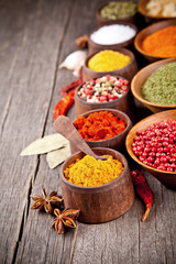  Various kind of spices in wooden bowls