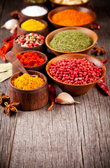  Various kind of spices in wooden bowls