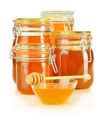 Composition with jar of honey isolated on white