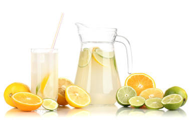Citrus lemonade in pitcher and glass of citrus around isolated
