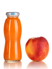 Delicious peach juice in glass bottle and peach next to it