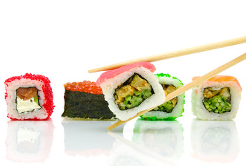 Japanese sushi and chopsticks on white background