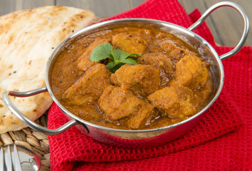 Goan Pork Vindaloo - Indian pork curry with naan bread
