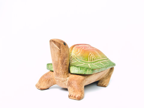 A handicraft colorful wooden turtle isolated on white background