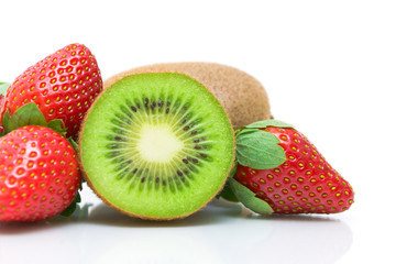half kiwi and strawberries close-up on white background
