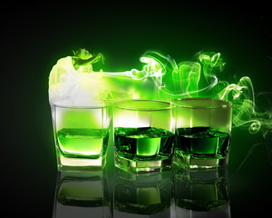 Three glasses of green absinth