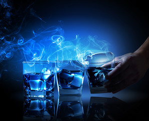 Three glasses of blue cocktail