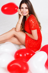 Valentines day woman holding red heart balloon