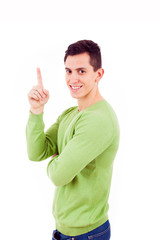 Young casual man pointing up, isolated on white