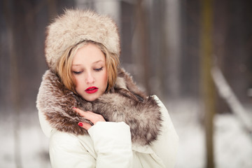 Beautiful girl in wintertime outdoor