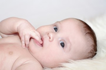 Portrait of the happy four-months baby