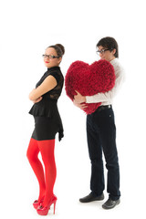 funny romantic couple holding red heart