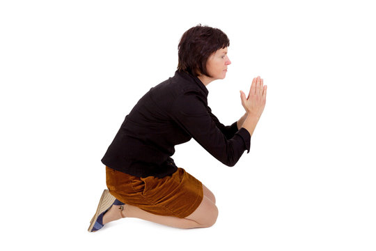 Woman kneeling and praying