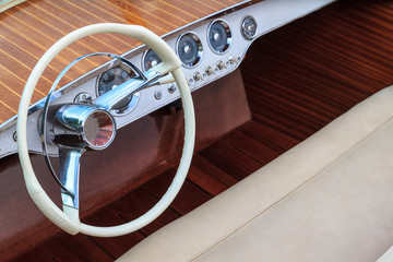 Luxury wooden motor boat - steering wheel and leather seats