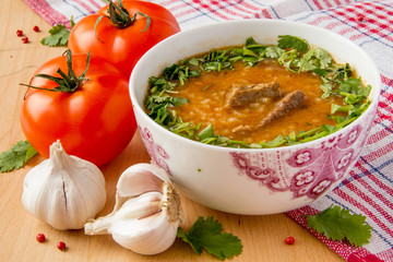 Oriental tomato soup with meat, rice and cilantro