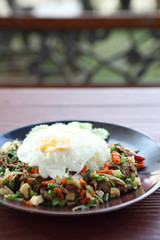 mushroom with basil and egg served with rice