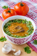 Oriental tomato soup with meat, rice and cilantro