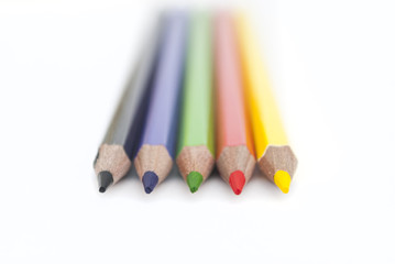 Colored pencils on white background