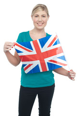 Proud UK female supporter holding national flag