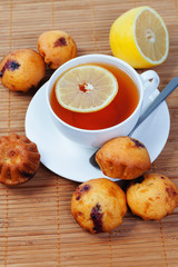 Cup of tea, cakes and lemon