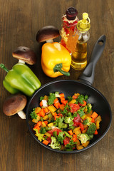 Sliced fresh vegetables in pan with spices and ingredients