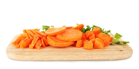 carrots on cutting board on table in kitchen