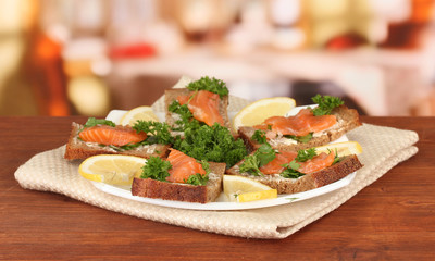 Salmon sandwich on plate,on bright background