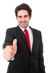 Smiling young business man with thumbs up gesture, isolated over