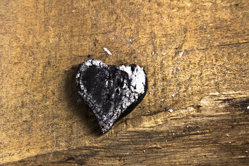 Burned wooden firebrand love heart