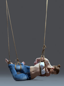 Young woman with shibari in studio