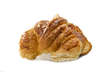 Fresh and tasty croissant on the white