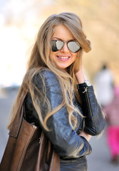 Beautiful female with handbag wearing sunglasses