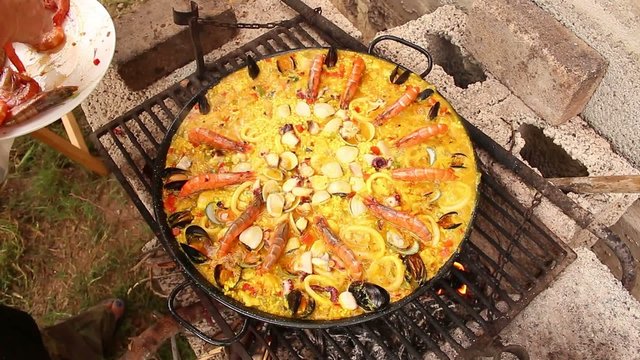 Seafood paella in the fry pan, typical Spanish dish (paella de m