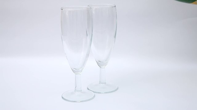 Sparkling wine poured into two wineglasses