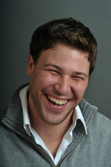 Obraz premium Young male actor making emotional facial expression