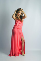 Fototapeta premium beautiful girl in rose long year peasant woman's dress
