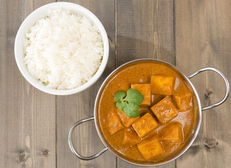 Paneer Butter Masala - Indian curd cheese curry and rice.