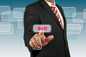 Businessman push Sell button