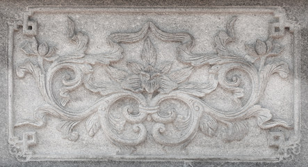 Tree and flowers on carve wall