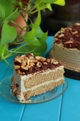 Coffee cake topped with cashew nuts.
