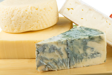 Variety of cheese: ementaler, gouda, Danish blue soft cheese and