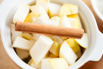 slices of pear and cinnamon in a pot