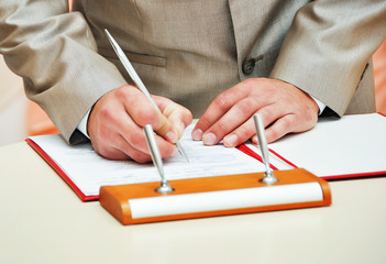 Newly-married couple signs documents