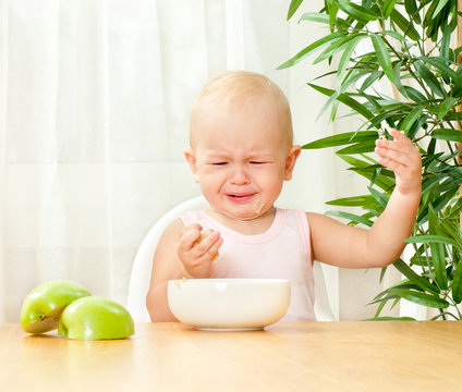 child at the table does not want to eat