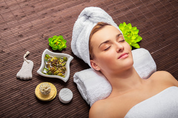 Young beauty woman in a spa with closed eyes