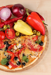 Delicious pizza with ingredients close-up