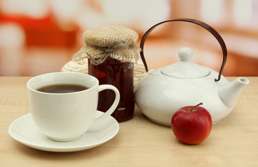 light breakfast with tea and homemade jam, on wooden table