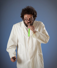 Weird scientist drinking green liquid